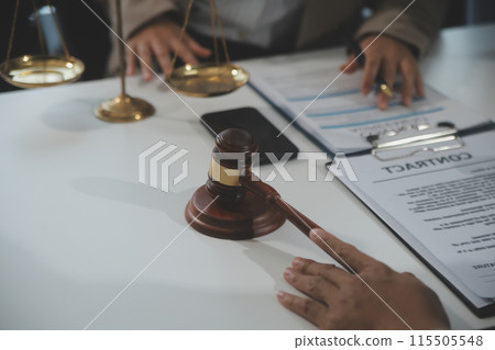 Judge gavel with Justice lawyers having team meeting at law firm background. Concepts of Law and Legal services. 115505548