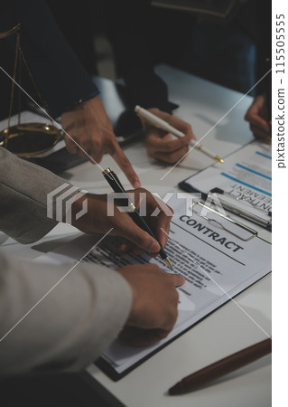 Judge gavel with Justice lawyers having team meeting at law firm background. Concepts of Law and Legal services. 115505555