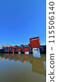 Blue sky and red floodgate 115506140