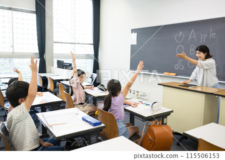An English lesson in a Japanese elementary school classroom: teacher and children 115506153