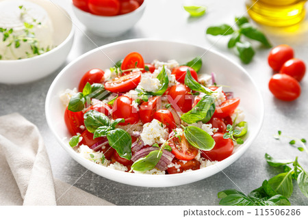 Salad of tomato, ricotta cheese and basil 115506286