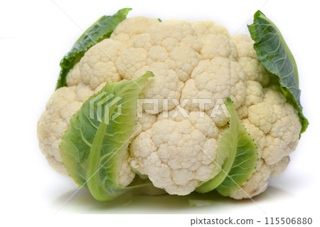 Whole head of the fresh raw cauliflower with some leaves close-up on a white background Whole head of the fresh raw cauliflower with some leaves close-up on a white background 115506880