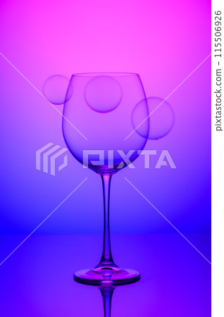 wine glass with soap bubbles on blue and pink background 1 wine glass with soap bubbles on blue and pink background 1 115506926