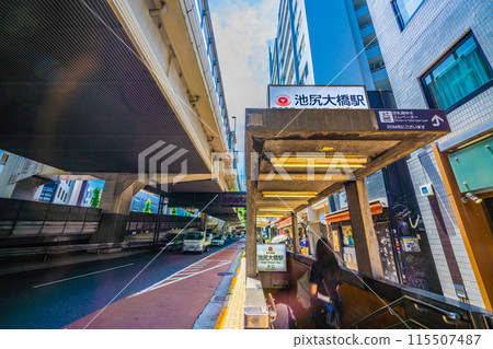 Tokyo cityscape in Japan, June. View of the north exit of Tokyu Ikejiri-Ohashi Station. 20m ahead is the elevator to the ticket gate floor. 115507487