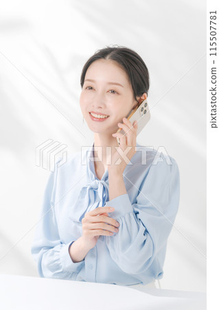 A woman making a phone call A woman making a phone call 115507781
