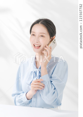 A woman making a phone call A woman making a phone call 115507782