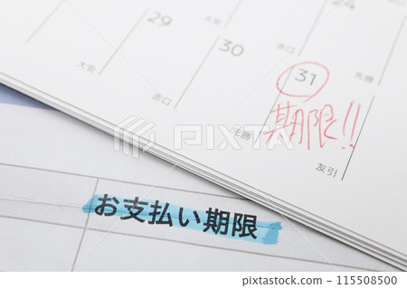 Documents and calendar with payment due date written on them Documents and calendar with payment due date written on them 115508500