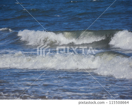 Beautiful wave scenery of the ocean surface on the beach photographed close up Beautiful wave scenery of the ocean surface on the beach photographed close up 115508664