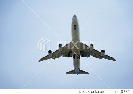 Airplane is flying in the sky with the landing gear down Airplane is flying in the sky with the landing gear down 115510275