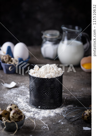 Baking ingredients with flour and eggs 115510632