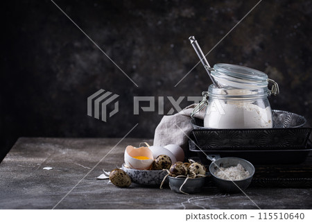Baking ingredients with flour and eggs Baking ingredients with flour and eggs 115510640