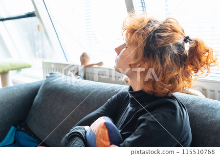portrait naked crying teenage girl, with red curly hair, sitting on sofa, hugging pillow, in fetal position portrait naked crying teenage girl, with red curly hair, sitting on sofa, hugging pillow, in fetal position 115510768