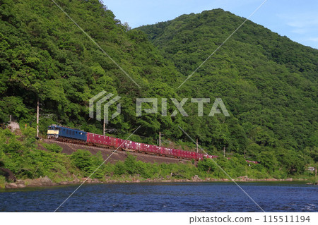 Fresh greenery on the Takahashi River and a freight train hauled by an EF64 on the Hakubi Line Fresh greenery on the Takahashi River and a freight train hauled by an EF64 on the Hakubi Line 115511194
