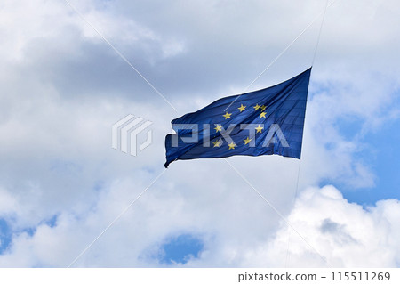 European Union Flag on a Cloudy Sky 115511269