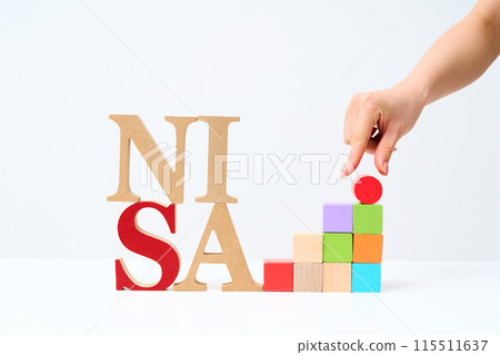Wooden alphabet blocks arranged with "NISA" Wooden alphabet blocks arranged with "NISA" 115511637