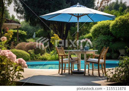Cafe table with chair and parasol umbrella in the garden 115511878