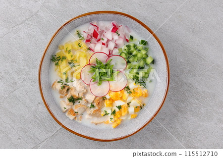 Okroshka smoked chicken breast - Russian cold soup with vegetables on white wooden background. Selective focus Okroshka smoked chicken breast - Russian cold soup with vegetables on white wooden background. Selective focus 115512710