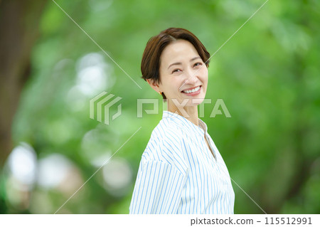 Title: Woman in the midst of fresh greenery - Beauty Title: Woman in the midst of fresh greenery - Beauty 115512991