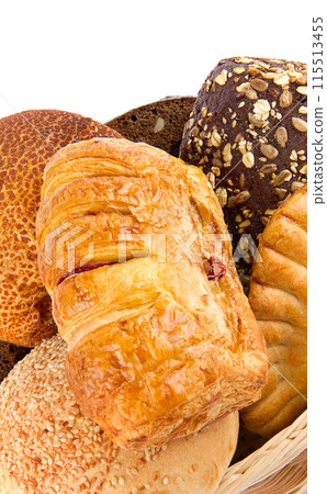 Fresh baked wheat buns isolated on white. Vertical photo. Free space for text. Fresh baked wheat buns isolated on white. Vertical photo. Free space for text. 115513455