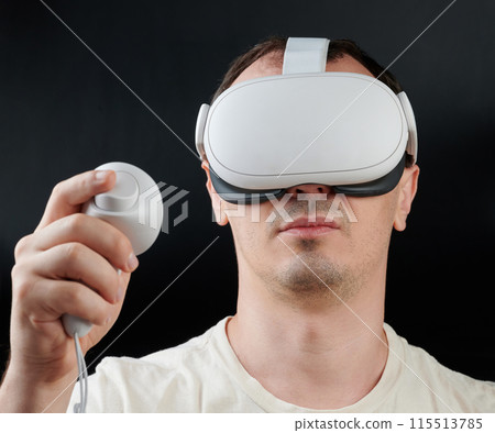 Portrait of man playing in Virtual reality Portrait of man playing in Virtual reality 115513785