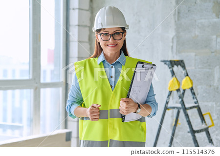 Portrait of woman builder engineer supervisor at construction Portrait of woman builder engineer supervisor at construction 115514376