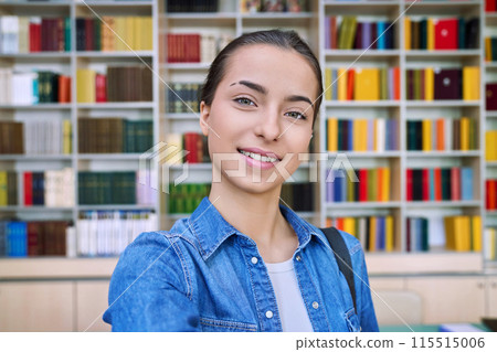 Selfie portrait of happy cheerful high school student girl, inside library Selfie portrait of happy cheerful high school student girl, inside library 115515006