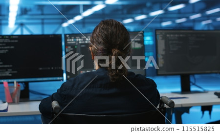 Person with disability in inclusive server hub workspace ensuring data remains shielded from threats. Close up shot of wheelchair user safeguarding data center establishment infrastructure 115515825