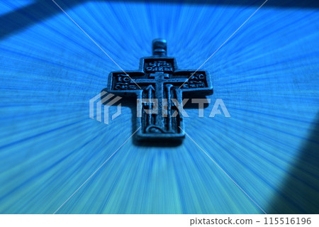 Antique cross from the 19th century.Old Slavonic male cross against the background of the temple. 115516196