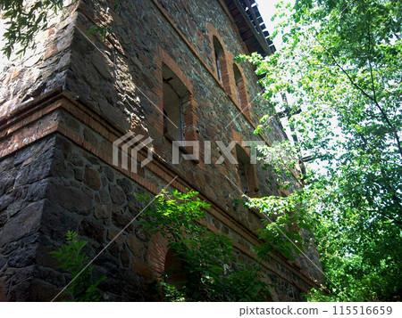 Old water mill.Stone building for grinding grain into flour. The reverse side of the building overlooks the Southern Bug River.The building has been completely abandoned since the 2000s. Old water mill.Stone building for grinding grain into flour. The reverse side of the building overlooks the Southern Bug River.The building has been completely abandoned since the 2000s. 115516659