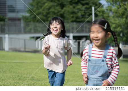 Children running on the lawn Children running on the lawn 115517551
