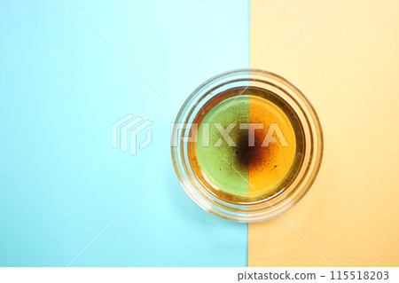 Used vegetable oil in a plate . 115518203