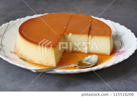 Caramel custard pudding on a plate on table Caramel custard pudding on a plate on table 115518206