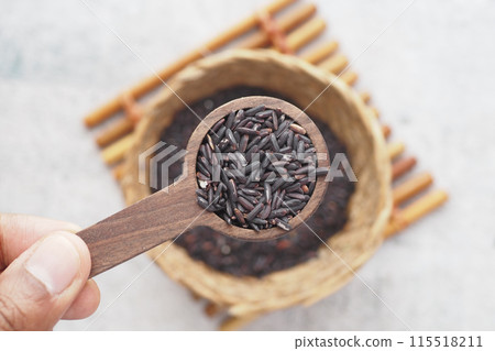 Black Rice Grains in a wooden spoon Black Rice Grains in a wooden spoon 115518211