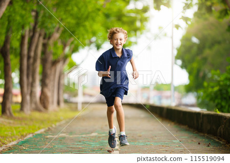 Kids run in summer park. Active child running. 115519094
