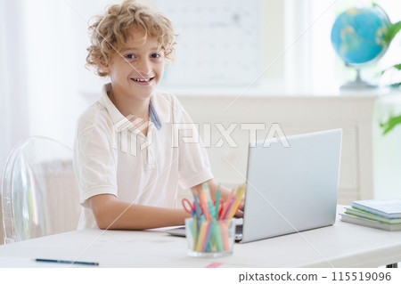 Child in school. Student in class. Boy at homework Child in school. Student in class. Boy at homework 115519096