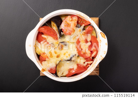 Eggplant and tomato baked with cheese Eggplant and tomato baked with cheese 115519114