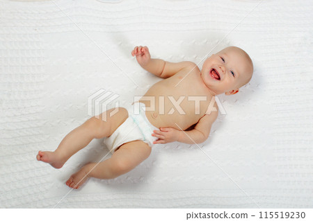 Little baby on white bed Little baby on white bed 115519230