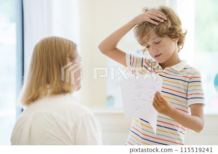 Kids fail math test in school. Child after exam. 115519241