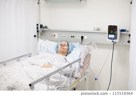 Young woman in hospital recovery room after surgery Young woman in hospital recovery room after surgery 115519364