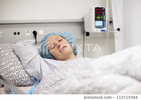 Young woman in hospital recovery room after surgery Young woman in hospital recovery room after surgery 115519368