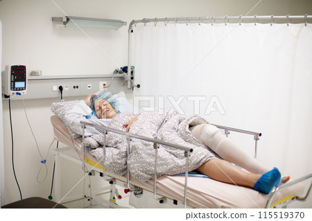 Young woman in hospital recovery room after surgery Young woman in hospital recovery room after surgery 115519370