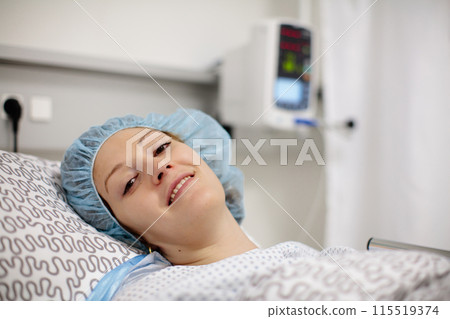 Young woman in hospital recovery room after surgery Young woman in hospital recovery room after surgery 115519374