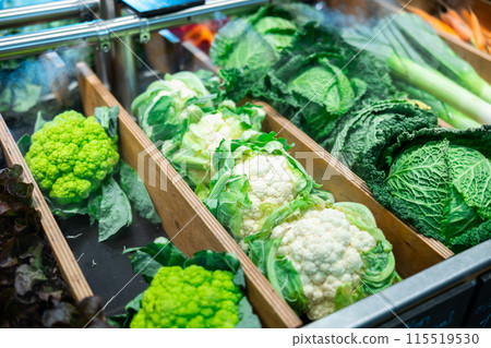 Market counter with assortment of farm fresh organic vegetables Market counter with assortment of farm fresh organic vegetables 115519530