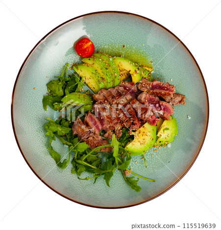 Tasty fried beef with avocado, parsley, sesame and tomatoes Tasty fried beef with avocado, parsley, sesame and tomatoes 115519639