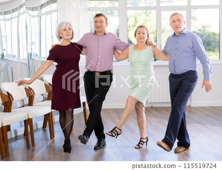 Group of elderly people with middle-aged man perform Irish folk dance Group of elderly people with middle-aged man perform Irish folk dance 115519724