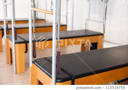 Closeup view of Pilates trapeze table for fitnes and rehabilitation exercises Closeup view of Pilates trapeze table for fitnes and rehabilitation exercises 115519750