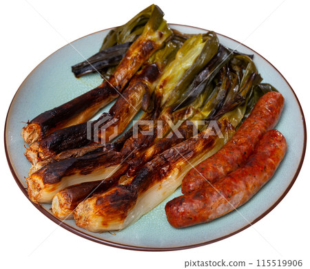 Traditional Spanish cuisine - Calsot con butifarra. Appetizer butifarra sausage and delicious calsot served on plate Traditional Spanish cuisine - Calsot con butifarra. Appetizer butifarra sausage and delicious calsot served on plate 115519906
