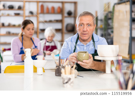 potter with his jug 115519956