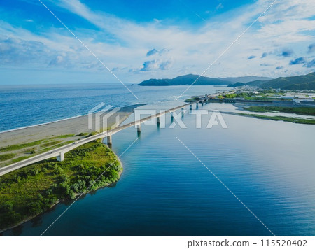 Aerial drone shot of the Niyodo River Estuary Bridge on a clear day. Kochi City, Kochi Prefecture Aerial drone shot of the Niyodo River Estuary Bridge on a clear day. Kochi City, Kochi Prefecture 115520402