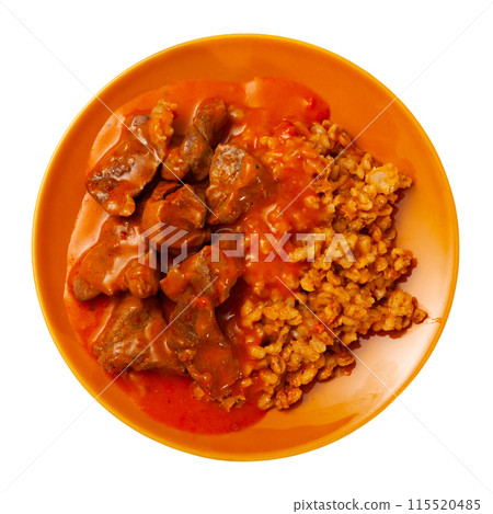 Tender pieces of beef in gravy with pearl barley closeup Tender pieces of beef in gravy with pearl barley closeup 115520485